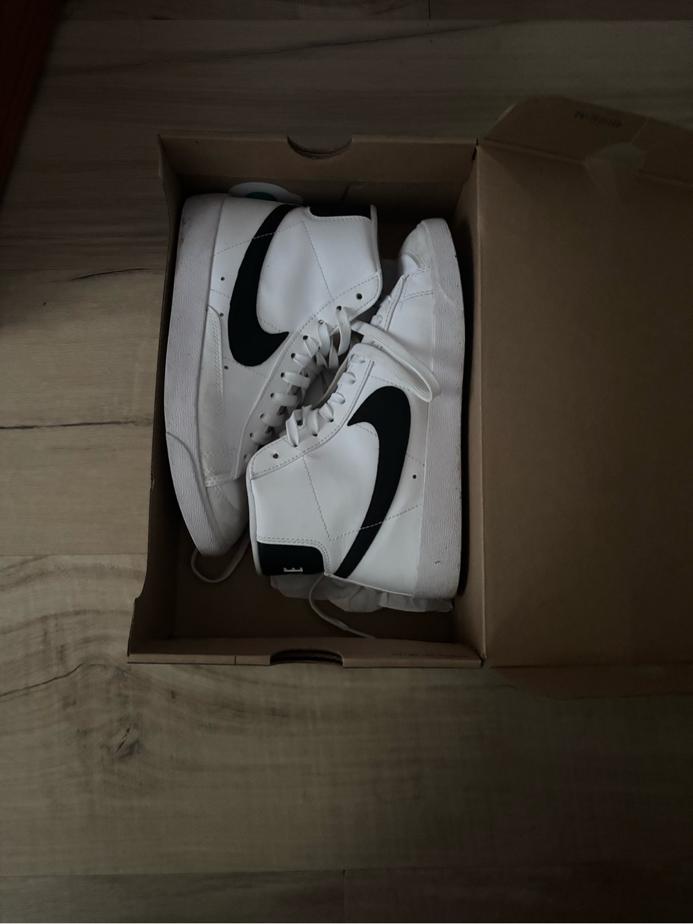 Nike White and Black High-Top Sneakers with Black Swoosh